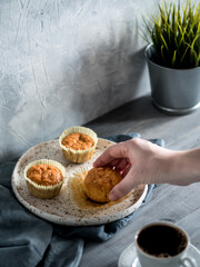carrot muffins on gray wooden table