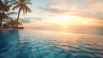 Blurred view of a luxurious hotel pool overlooking a paradisiacal beach at sunset with no one in the image 04 - obrazy, fototapety, plakaty