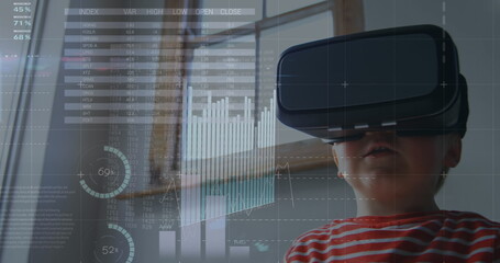 Image of financial data processing over caucasian boy using vr headset