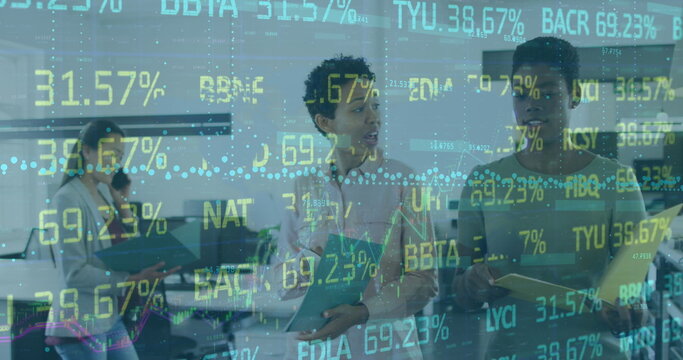 Image of trading board and graphs over diverse female coworkers discussing reports in office