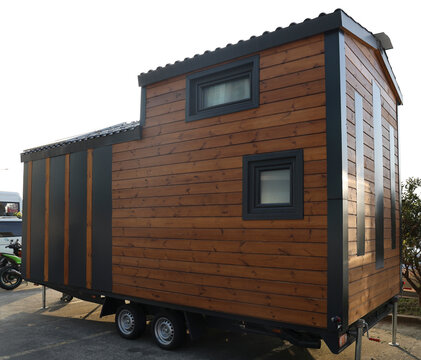Mobile tiny house, great for outdoor experiences and holidays.  mobility and pure adventure. construction of a mini house. relocated on city. House on wheels. motor home. caravan. solar panels on roof
