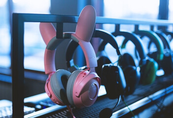 Colored headphones in the shop window of electronics and digital technology.