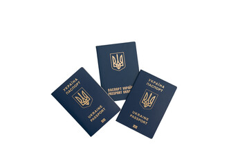 Three foreign passports of Ukraine on a white background. Three passports of Ukrainian citizens or migrants for visa-free travel to the European Union isolated on white background.