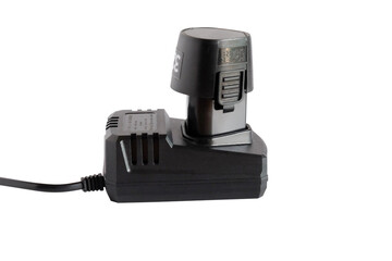 Rechargeable battery drill and charger for electric cordless tools such as jigsaw, screwdriver on white background.