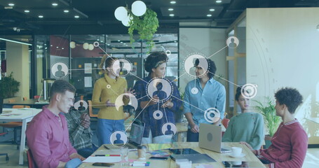 Image of network with data processing over diverse business people working in office