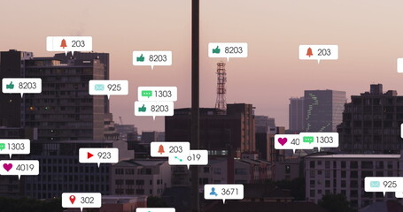 Image of social media icons against aerial view of cityscape