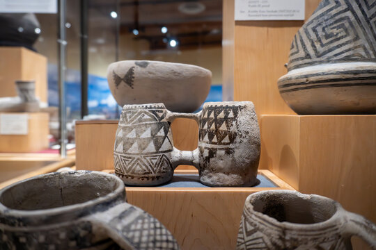 Ancient Puebloan pottery. Double Mug Mesa Verde Black-on-white ceramic on display at Canyons of the Ancients Visitor Center and Museum. Pueblo III period, Mesa Verde ceramic, Native American art. 