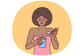 African American woman eating ice cream enjoying cold dessert to cool down after hot walk. Curly ethnic girl with ice cream satisfies hunger and licks lips wanting to be refreshed in summer weather - 785542929