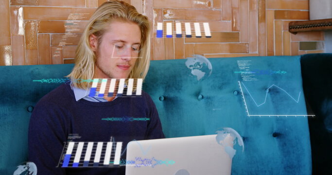 Image of graphs, globes and computer language, caucasian man working on laptop