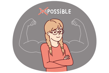 Proud little girl stands with arms crossed near inscription impossible is possible and muscular arms drawn on blackboard. Schoolgirl teenager successfully cope with challenge and gained new knowledge