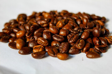 Top view background of aromatic brown coffee beans scattered on surface
