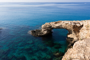 Fototapeta na wymiar Cyprus, Bridge of Lovers, rock arch and nice blue sky