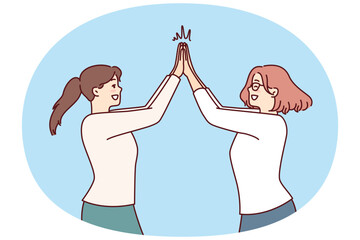 Two happy women rejoice high five greet each other after long-awaited meeting. Positive girls in casual clothes are happy to know about next vacation and joint summer trip - 785546751