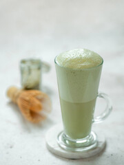 Green foam texture of matcha latte, close up