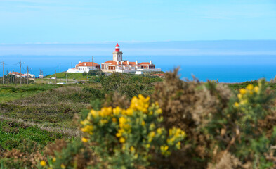 Fototapeta na wymiar Lighthouse on Cabo da Roca, the western most spit of Europe near Cascais at the atlantic ocean coast of Portugal