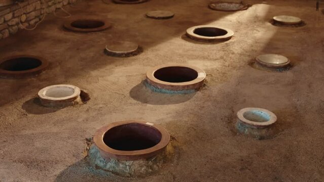 View of underground cellar for storing georgian wine in kvevri