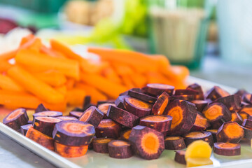 Various carrots and other vegetables cut into small pieces as a raw vegetable platter