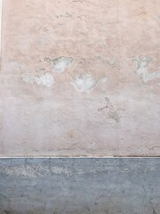 Cracked wall surface. Old building. Neutral pastel colour background