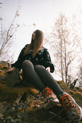 person sitting on a tree