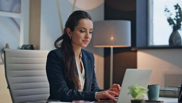 Smiling lady working laptop at buro closeup. Happy woman closing computer lid