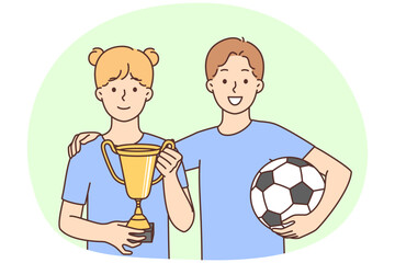 Smiling children with ball and golden prize