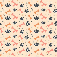 pattern of small dog bones and paw prints in pastel peach colors