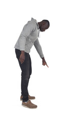 side view of a man pointing down on white background - 785571327