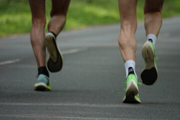 Motion blur of two runners legs and sport shoes