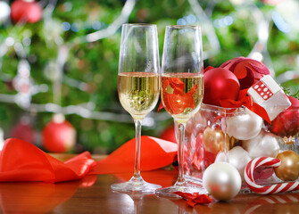Glasses of champagne near the Christmas tree