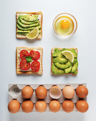Variation of healthy breakfast toasts with avocado and cherry to