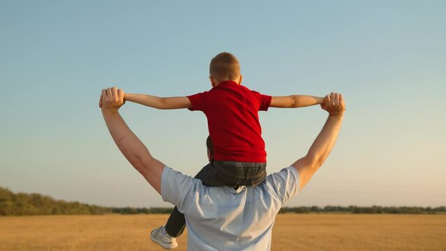 happy family father son child kid baby flight pilot superhero sky dream, rural field fun, father's love, carefree childhood, parental support, playful childhood, open field play, happy child outdoors