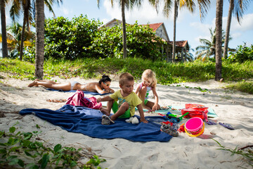 mom  with children, playing with kids, family on the beach, vacations in warm countries, Caribbean sea, Atlantic ocean, Cuba, childhood, parents, daughter, son