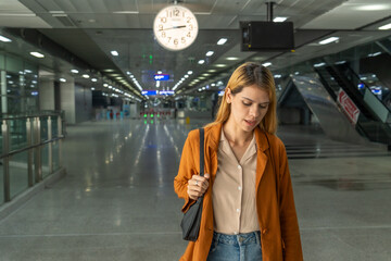 Woman Walking Through Modern Train Station