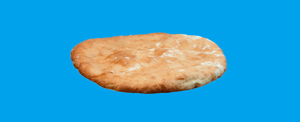 round georgian pita bread on a blue background. round flat bread on a light surface	