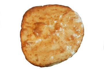 round Georgian pita bread on a white background. round flat bread on a light surface	