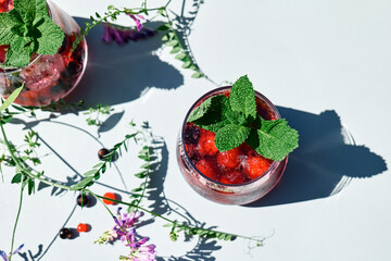 Berry refreshing cold summer drink. Cocktail or mocktail with ripe seasonal berries and mint. Detox...