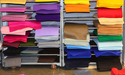 many colorful pieces of felt fabric for sale on shelf in hobby supplies store - 785639321