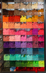 colorful rolls of felt fabric for sale on shelf in hobby supplies store - 785639331