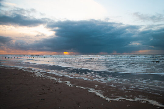 Wadden sea at low tide, North sea beach landscape, coast on Romo island in Denmark at sunset, vacation und lifestyle
