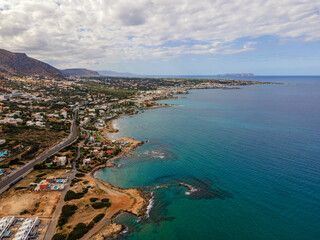 Aerial top view by drone of cretan landscape with sea. - obrazy, fototapety, plakaty