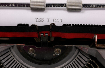 Typewritten YES I CAN  with vintage typewriter symbolizing the possibility of always succeeding - 785642139