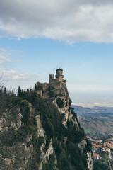 Fototapeta na wymiar view of the first castle tower of san marino country on top of steep hill in republic 