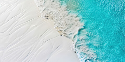 Surf line on the sea coast with white sand and turquoise water
