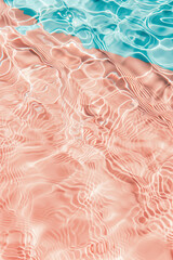 Flat lay of wavy water surface on pastel blue and peach fuzz background. Beach summer concept - 785649751
