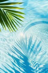 Fototapeta na wymiar Flat lay of circle transparent podium with palm tree leaves against blue water surface background. Spa, cosmetics and summer concept. Space for product