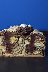 Panettone with Chocolate Filling on a Baking Tray Blue Background