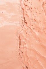 Flat lay water texture wavy peach fuzz background. Spa, cosmetics or summer concept - 785650327