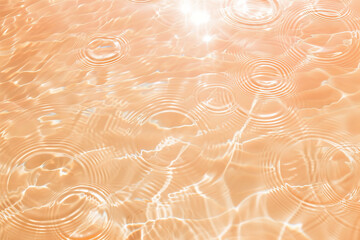 Flat lay water texture wavy peach fuzz background. Spa, cosmetics or summer concept - 785650792