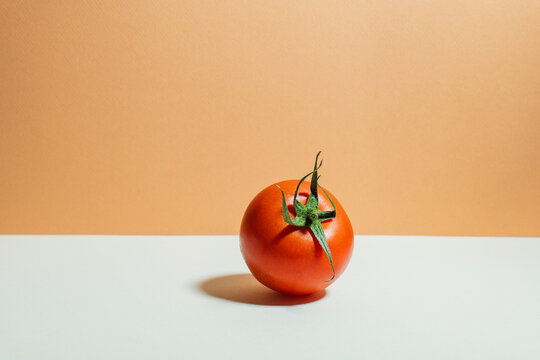 Fresh tomato on a two-tone background