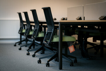 Modern office interior with ergonomic chairs and desks